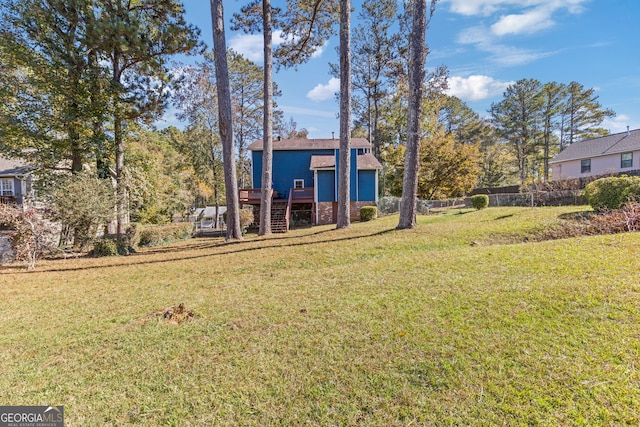 view of yard with a wooden deck