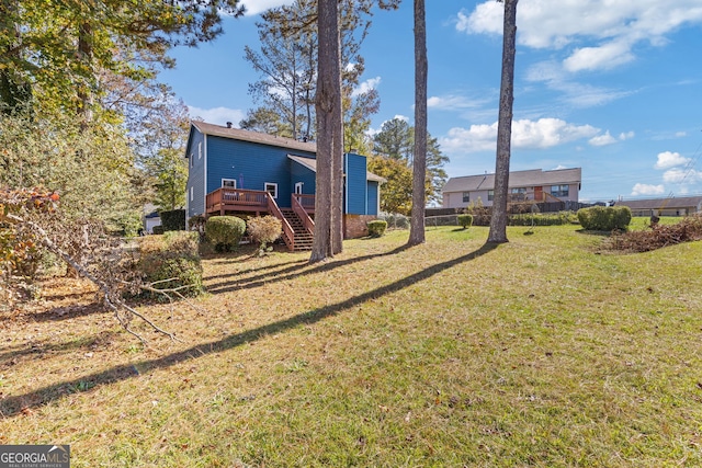 view of yard with a wooden deck