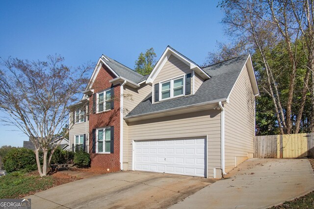 view of front of property featuring a front lawn and a garage