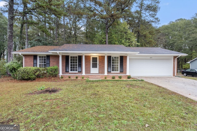 ranch-style house with a porch, a garage, and a front lawn