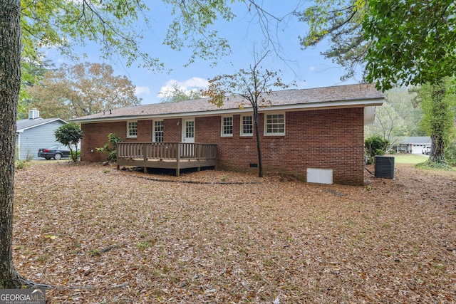 back of house with a deck