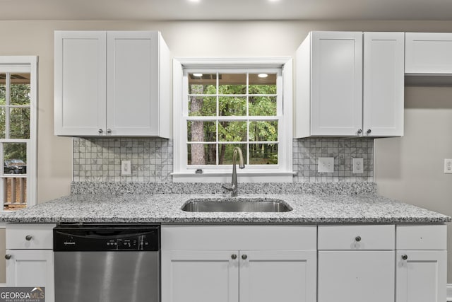 kitchen featuring dishwasher, white cabinetry, and a wealth of natural light