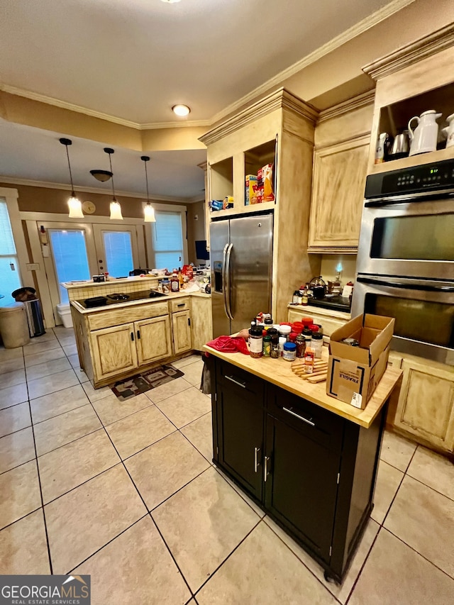 kitchen with a center island, light brown cabinets, hanging light fixtures, stainless steel appliances, and ornamental molding