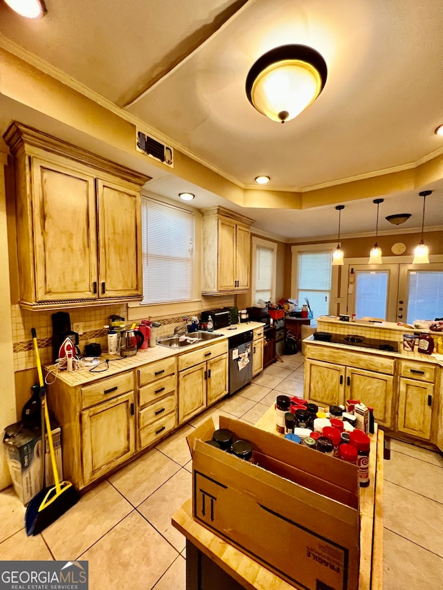 kitchen with decorative light fixtures, ornamental molding, sink, and light tile patterned floors