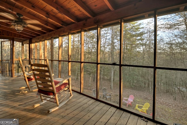 unfurnished sunroom with ceiling fan and wood ceiling