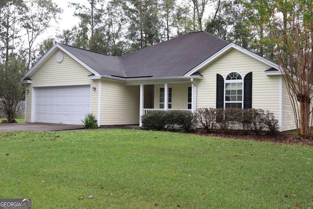 single story home with a front yard and a garage