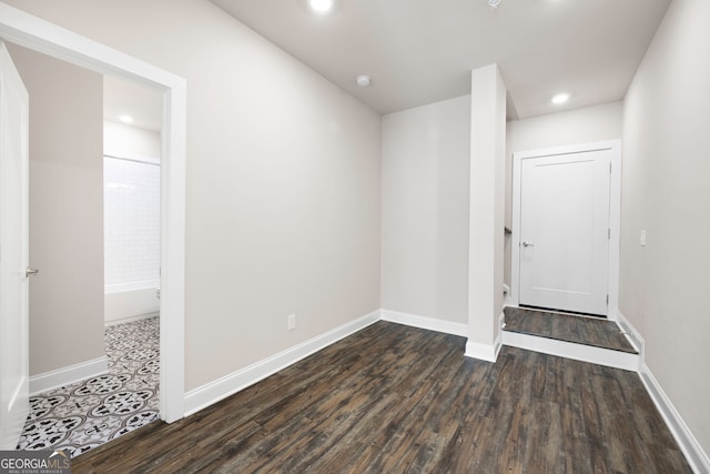 spare room with dark hardwood / wood-style flooring