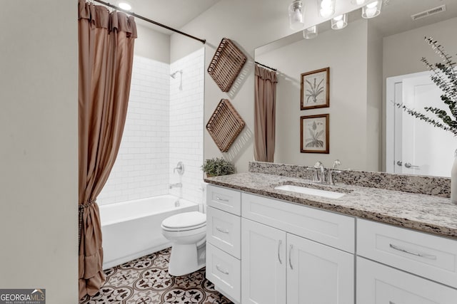 full bathroom with toilet, tile patterned floors, shower / bath combo, and vanity