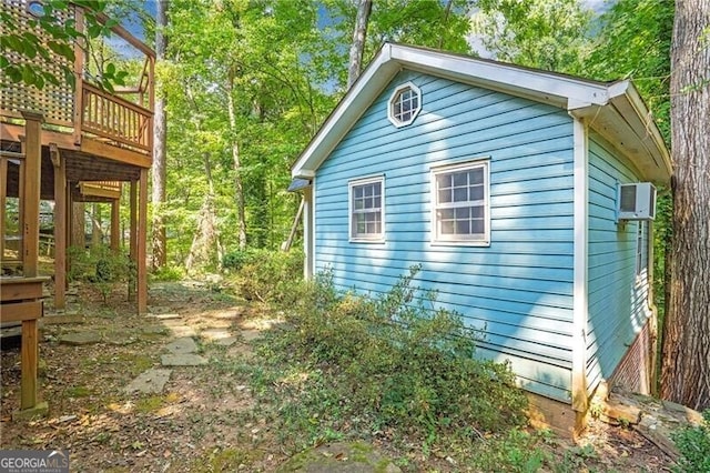 view of side of home with a deck