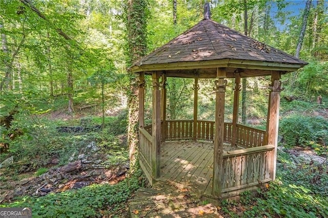 wooden deck featuring a gazebo