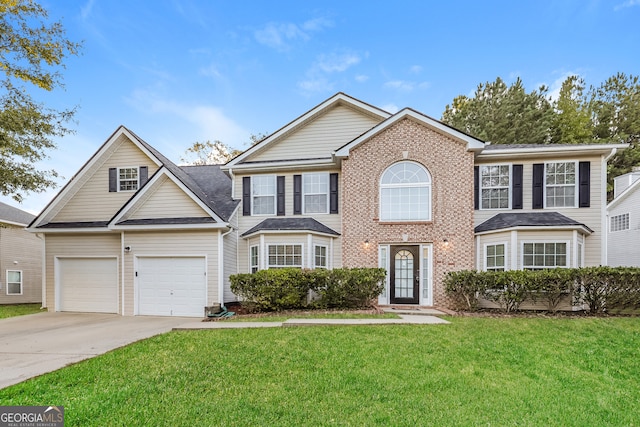 view of front of property featuring a garage and a front lawn