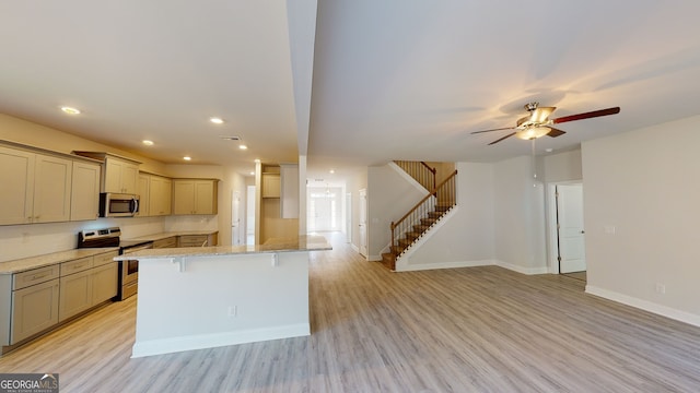 bathroom with hardwood / wood-style floors, vanity, and independent shower and bath