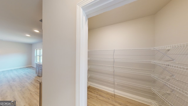 empty room featuring ceiling fan, crown molding, and light carpet