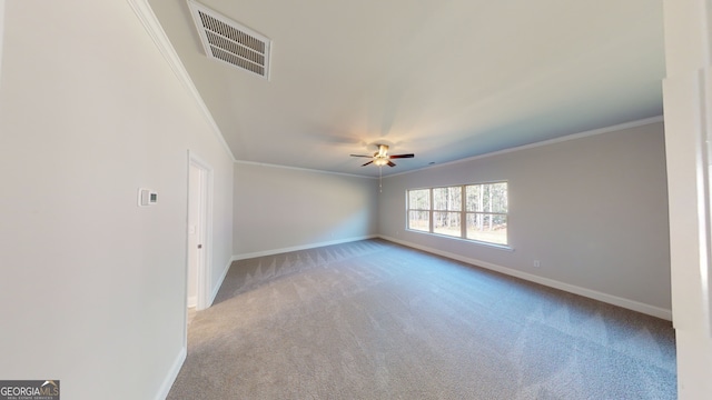 spare room featuring ornamental molding and light carpet