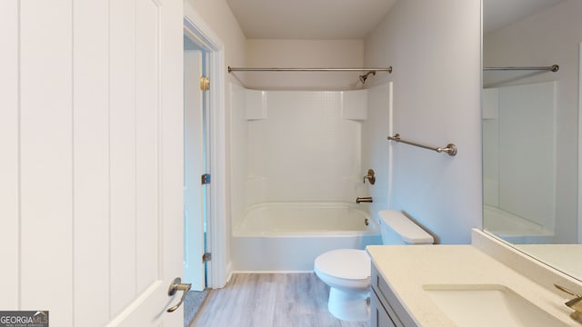 bathroom featuring hardwood / wood-style flooring and toilet