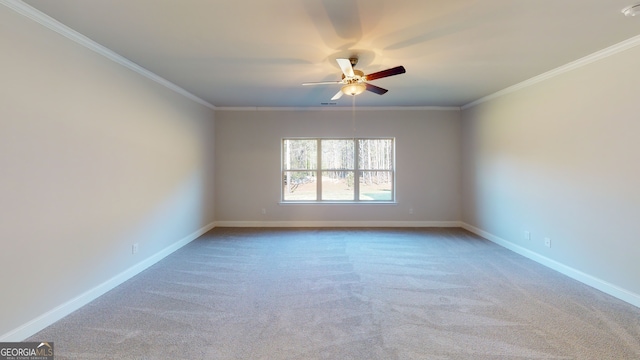 empty room featuring carpet flooring and ornamental molding