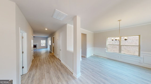 kitchen with sink, light stone counters, kitchen peninsula, light hardwood / wood-style floors, and appliances with stainless steel finishes