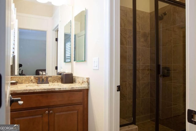 bathroom with vanity and an enclosed shower