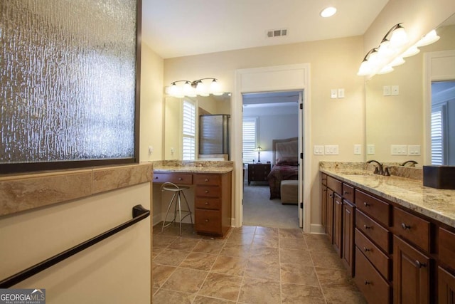 bathroom with vanity and plenty of natural light