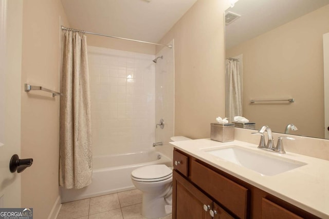 full bathroom featuring tile patterned floors, vanity, toilet, and shower / tub combo with curtain