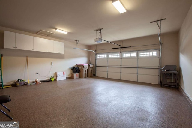 garage featuring a garage door opener