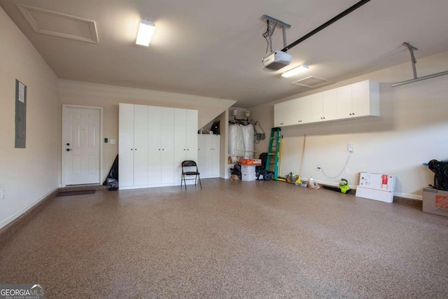 garage with electric panel and a garage door opener