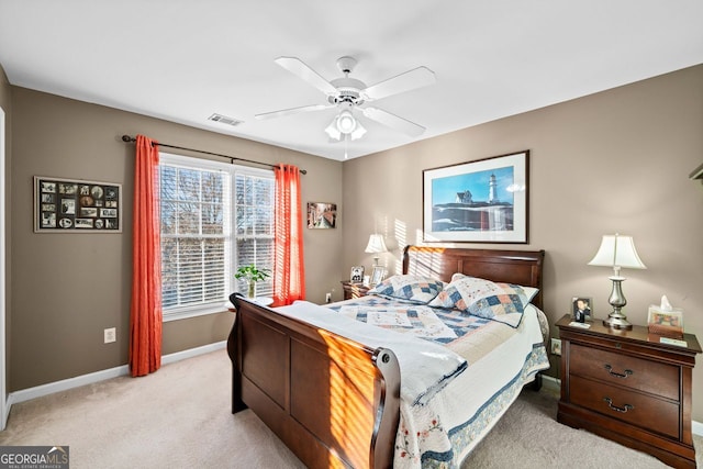 bedroom with ceiling fan and light colored carpet