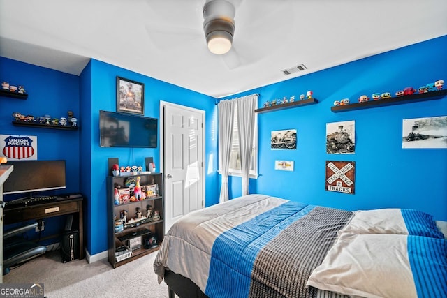 bedroom featuring ceiling fan and light colored carpet