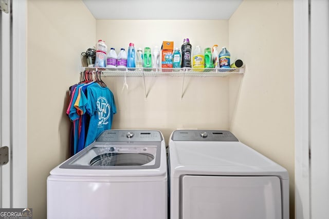 laundry room with independent washer and dryer