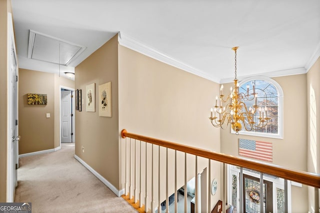 hall featuring a notable chandelier, light colored carpet, and ornamental molding