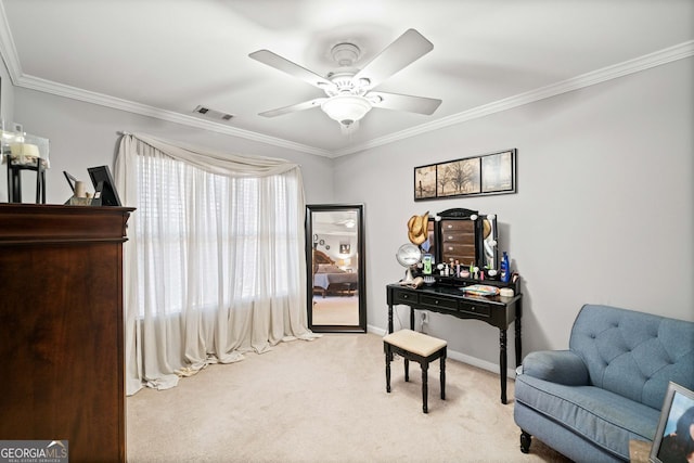 sitting room with light carpet, ceiling fan, and ornamental molding