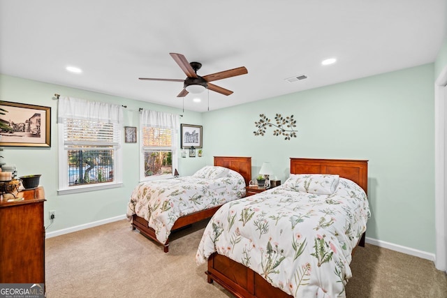 carpeted bedroom featuring ceiling fan