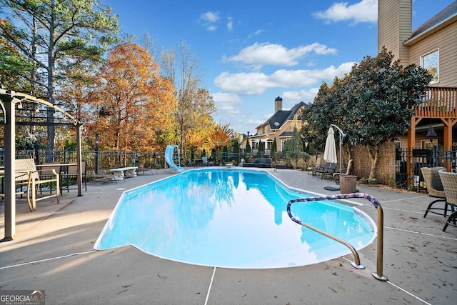 view of pool with a gazebo, a patio area, and a water slide