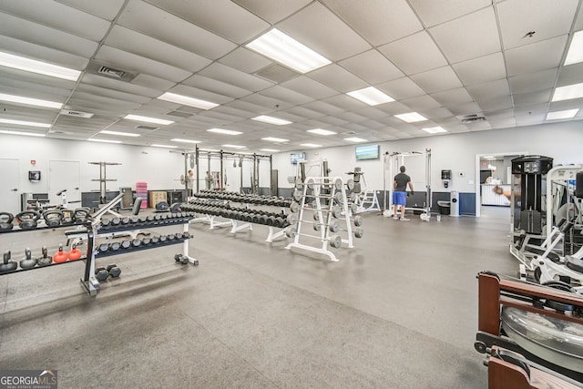 exercise room featuring a paneled ceiling