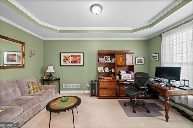 carpeted home office featuring a tray ceiling and crown molding