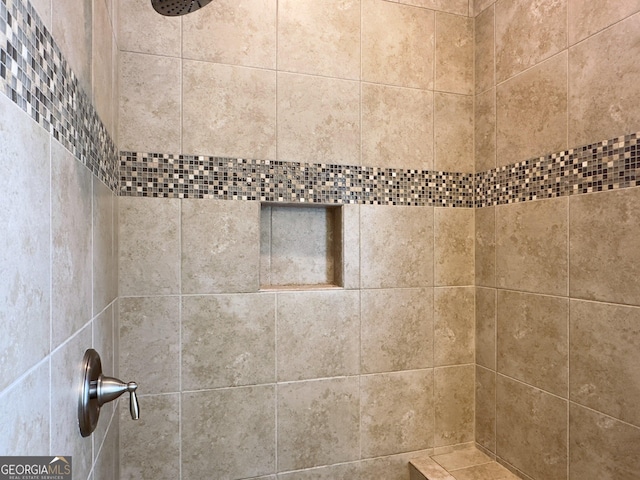 details featuring tiled shower