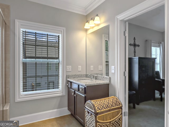 bathroom featuring tile patterned flooring, ornamental molding, baseboards, and vanity