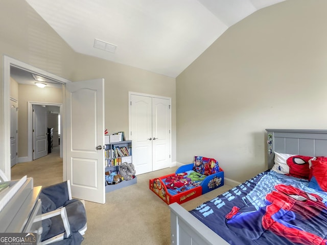 bedroom with vaulted ceiling, baseboards, visible vents, and light colored carpet