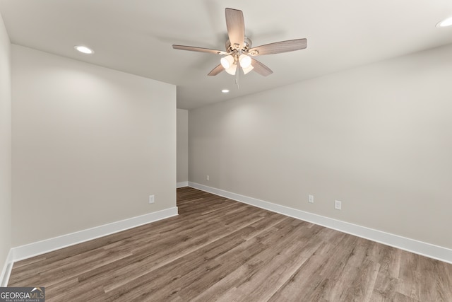 empty room featuring ceiling fan and wood-type flooring