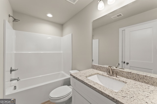 full bathroom with shower / tub combination, vanity, and toilet