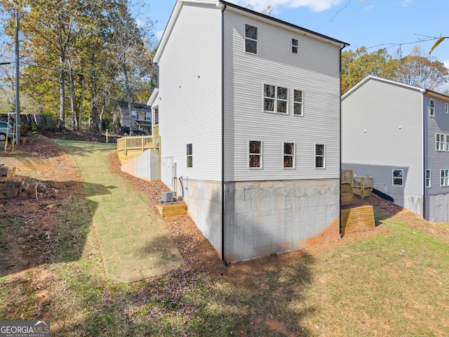 view of property exterior with a yard