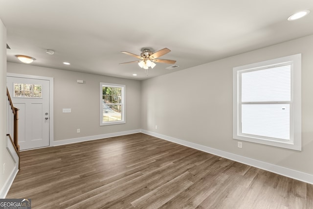 unfurnished room featuring dark hardwood / wood-style flooring and ceiling fan