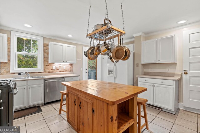 dining room with french doors, coffered ceiling, wood-type flooring, beam ceiling, and a chandelier