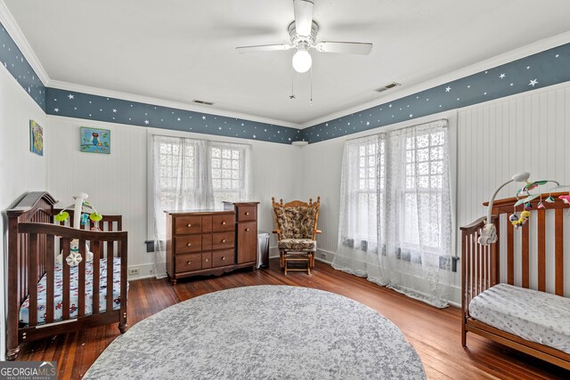 bedroom with ceiling fan, dark hardwood / wood-style flooring, and crown molding