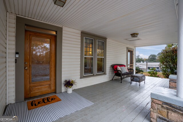 wooden deck featuring a porch