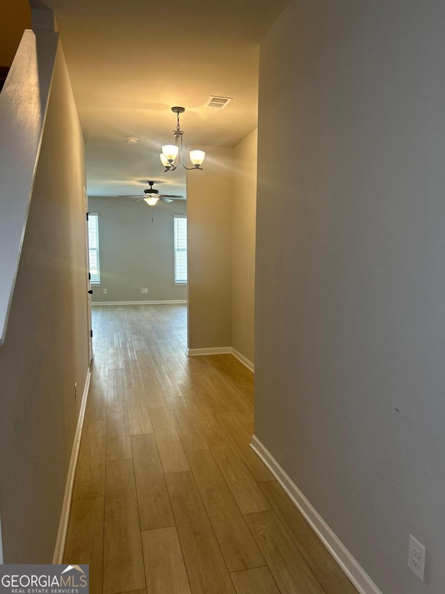 hall with light hardwood / wood-style flooring