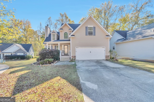 view of front of home featuring covered porch, a garage, and a front lawn