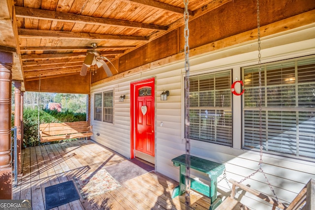 deck with ceiling fan and a porch