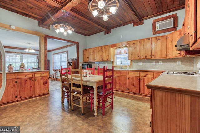 kitchen featuring sink, hanging light fixtures, decorative backsplash, a notable chandelier, and wood ceiling