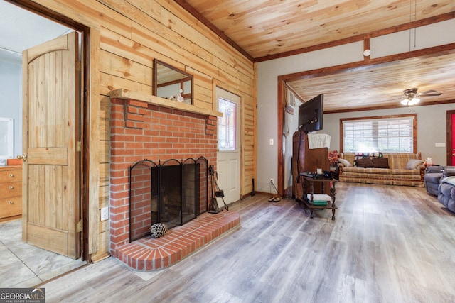 living room with wood ceiling, ceiling fan, a fireplace, and wood-type flooring